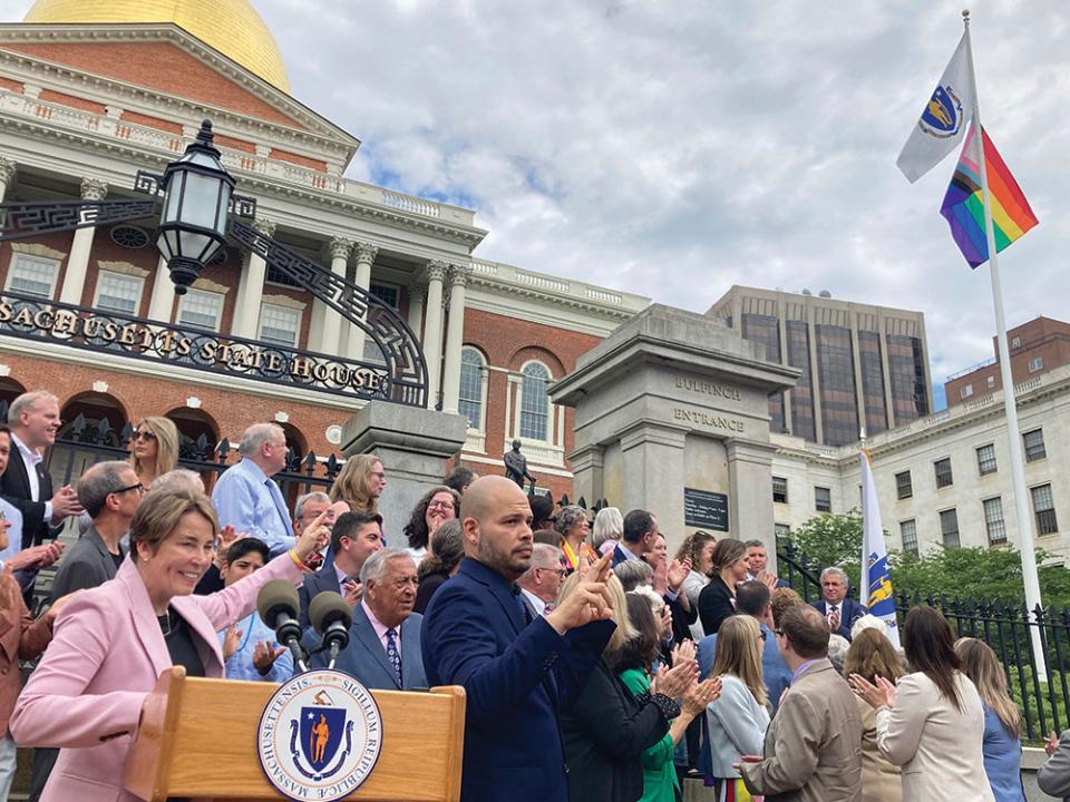 Massachusetts Gov. Maura Healey, left, joins with lawmakers and members of the LGBTQ community to mark Pride Month in front of the State House in Boston. AP Photo by Steve LeBlanc.
